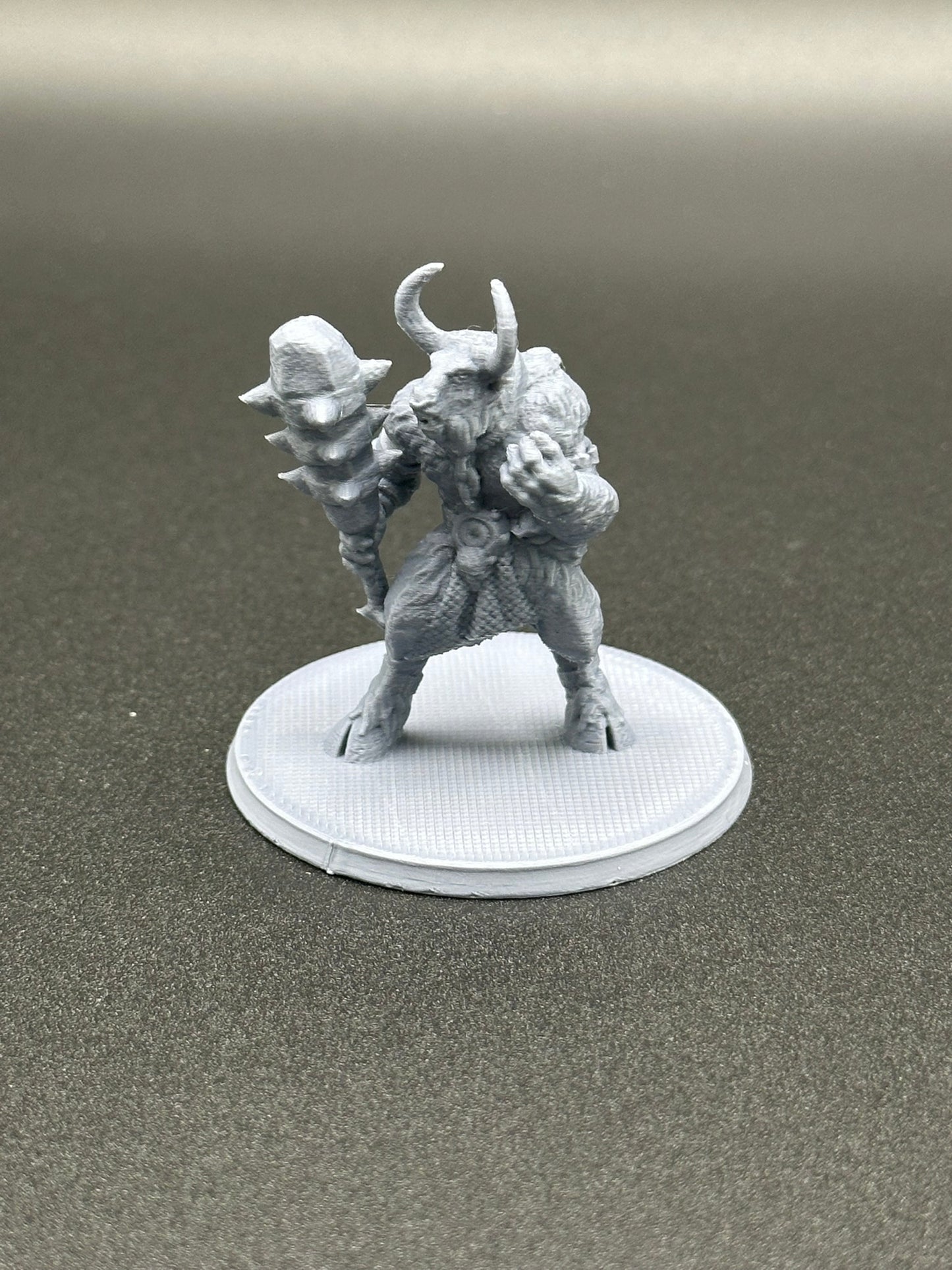 Savage Minotaur Miniature for Tabletop RPGs on a 2-inch base.