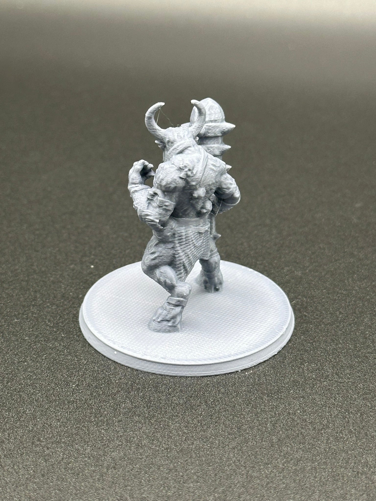 Savage Minotaur Miniature for Tabletop RPGs on a 2-inch base.