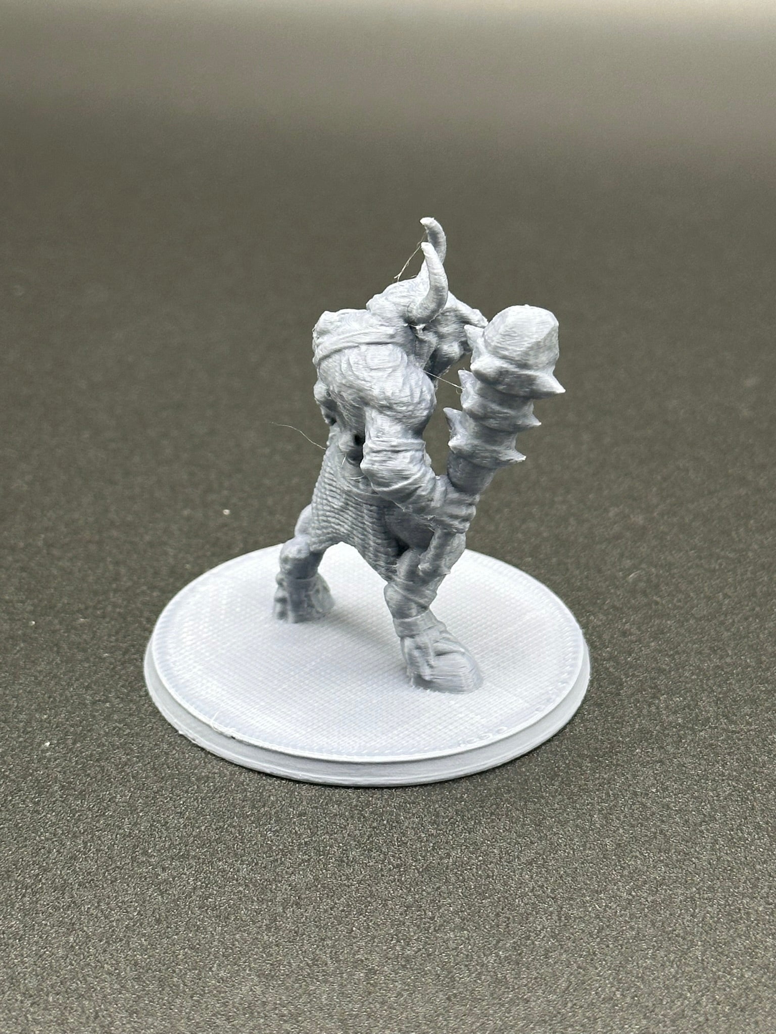 Savage Minotaur Miniature for Tabletop RPGs on a 2-inch base.